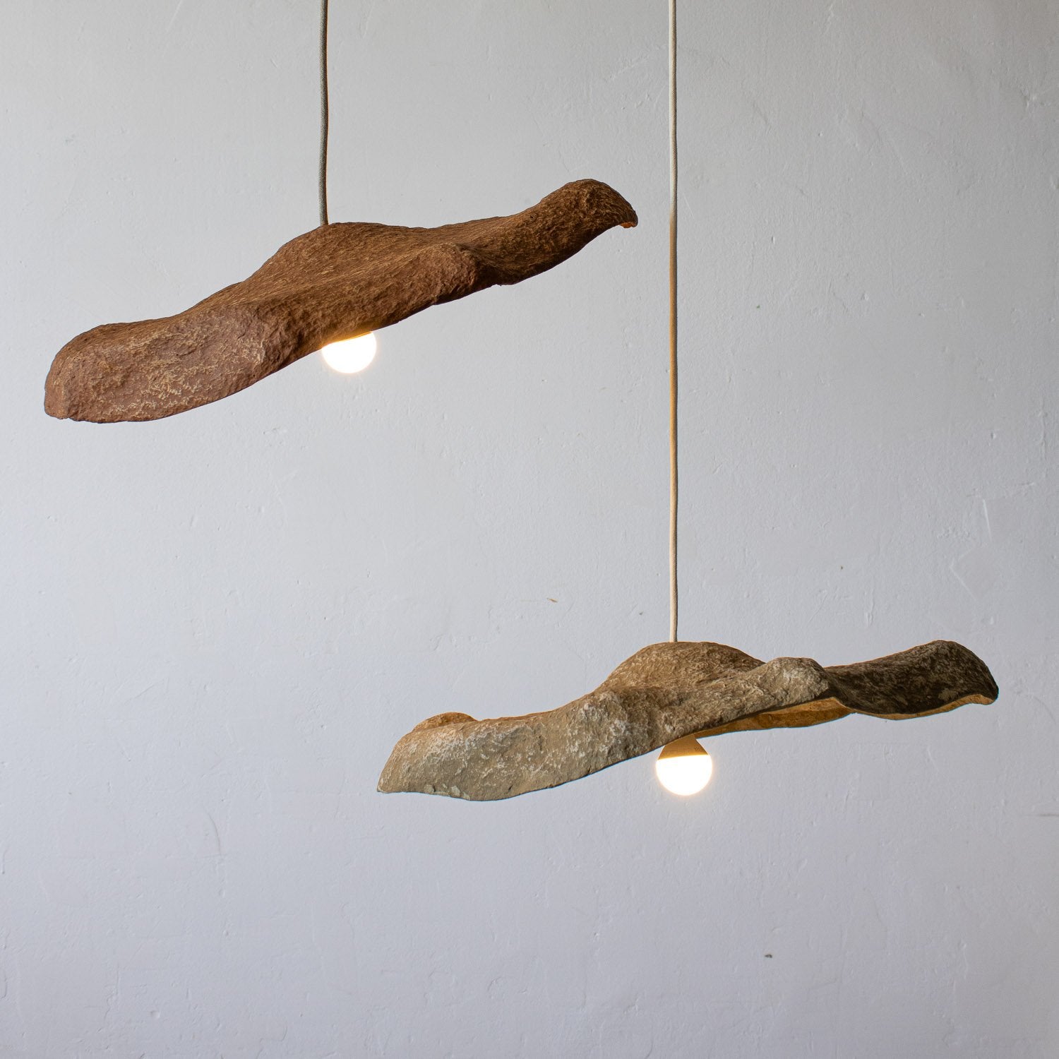 Decorative 50 cm pendants  light  from paper mache with a natural texture design in teracotta and dark beige color, irregular shape inspired by bird flight