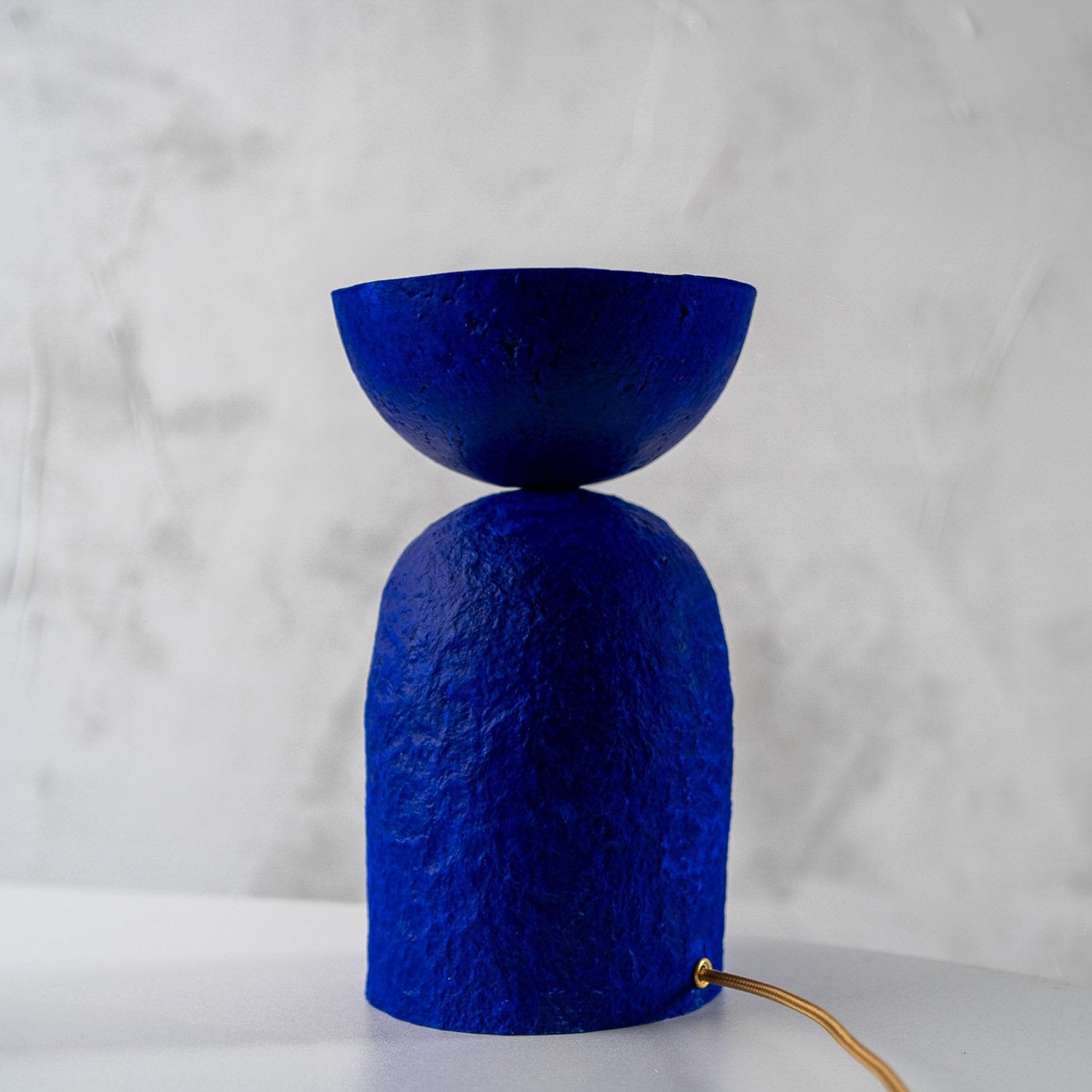 Ultramarine Blue textured bedside table lamp on a white background with paper mache texture
