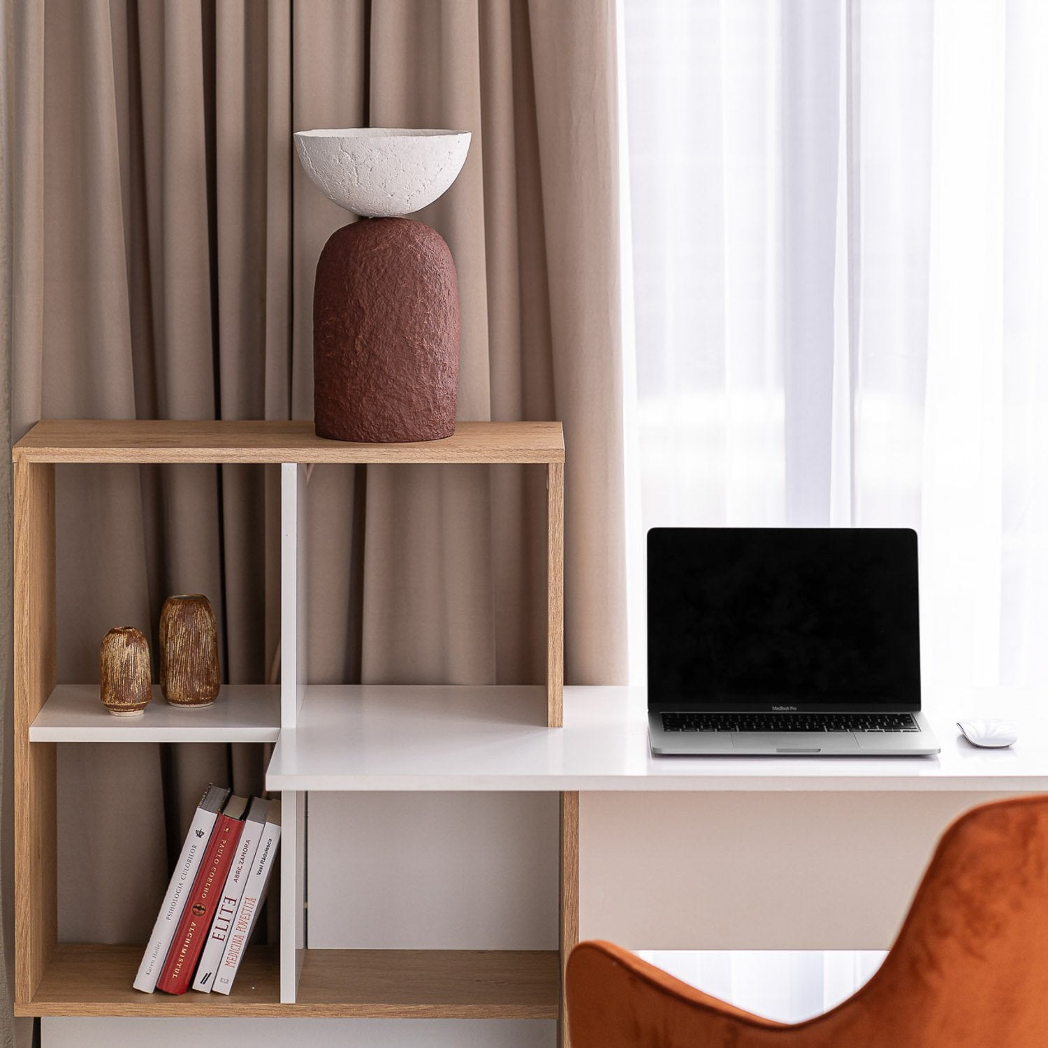 Modern office setup with a wooden shelf, laptop, and paper mache lamp in 2 colors in rounded shape